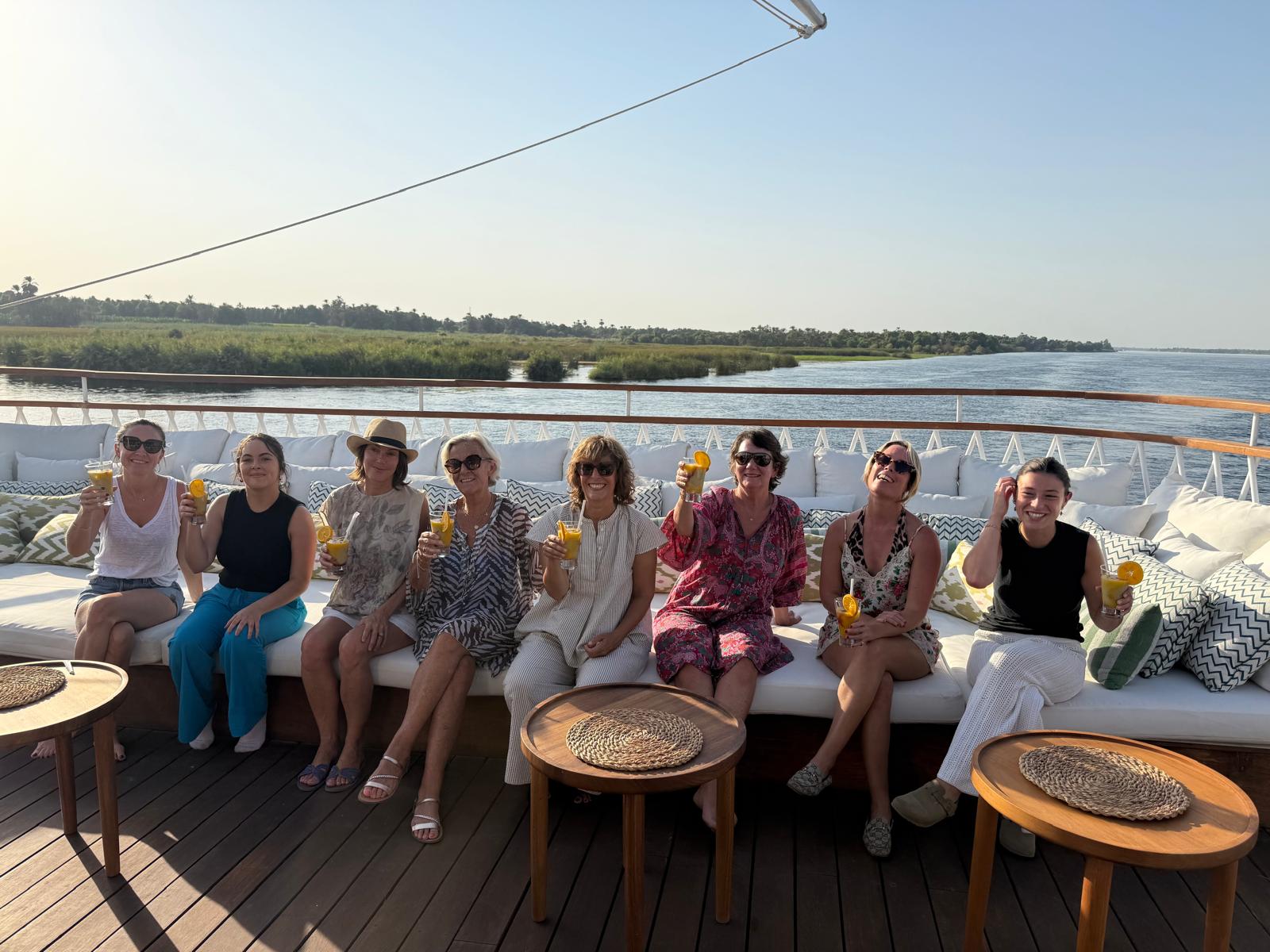 Guests relaxing together on Gaia's deck