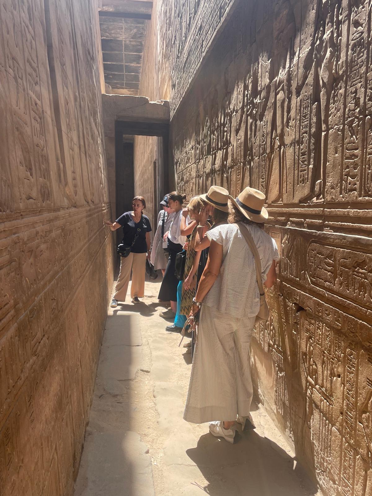 Guests exploring an ancient Egyptian temple