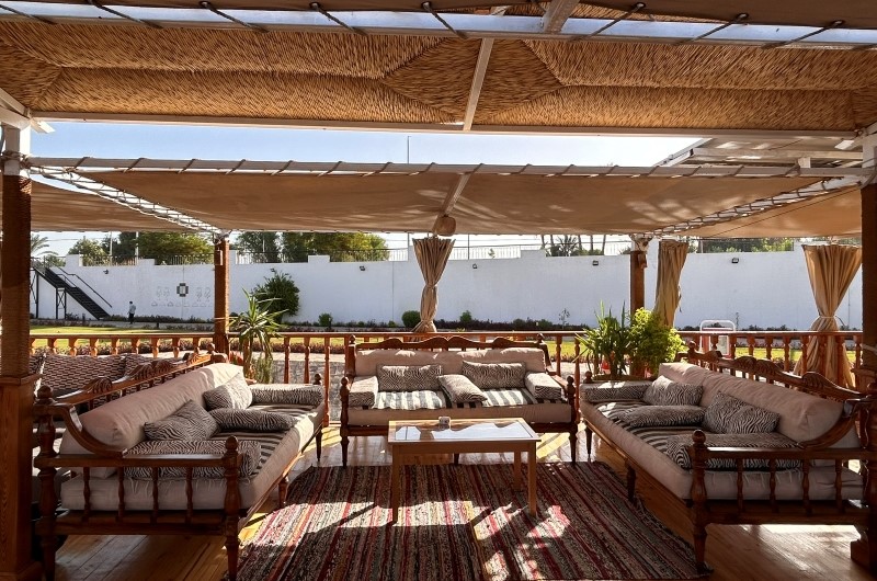 Shaded upper-deck lounge aboard Queen Farida