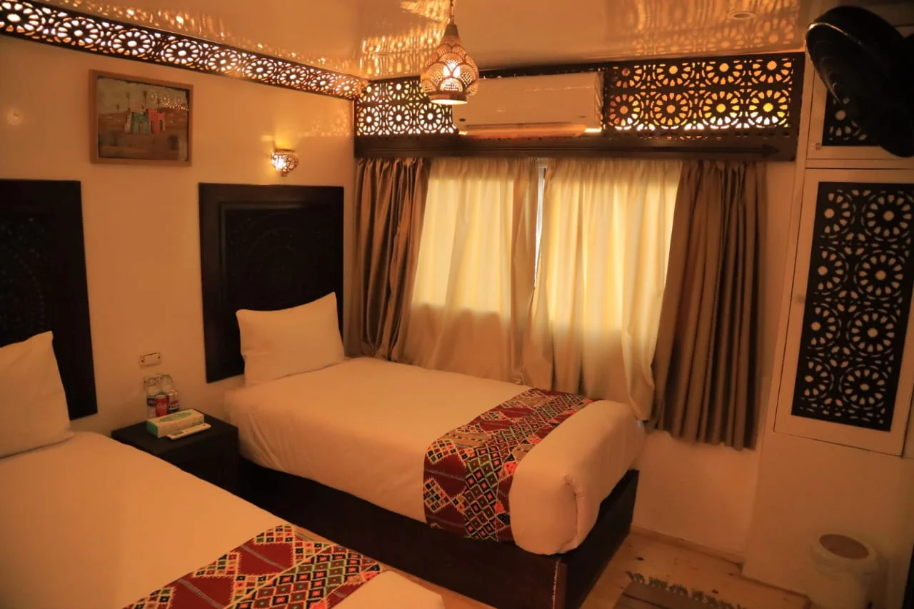 Panoramic-window twin cabin aboard Queen Nefer