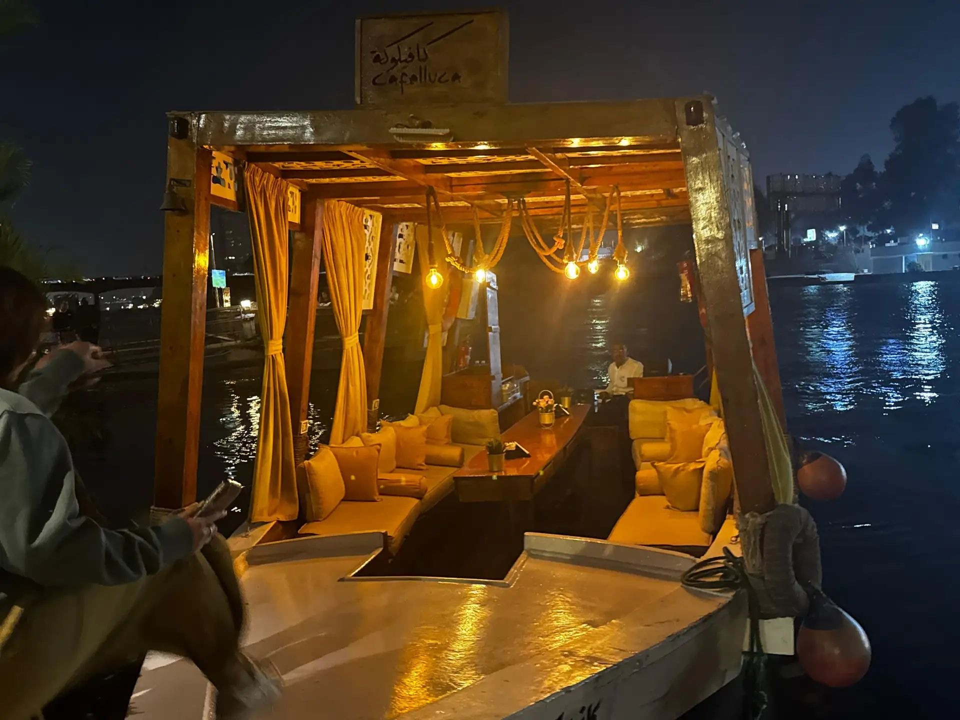 Private felucca cabin illuminated at night