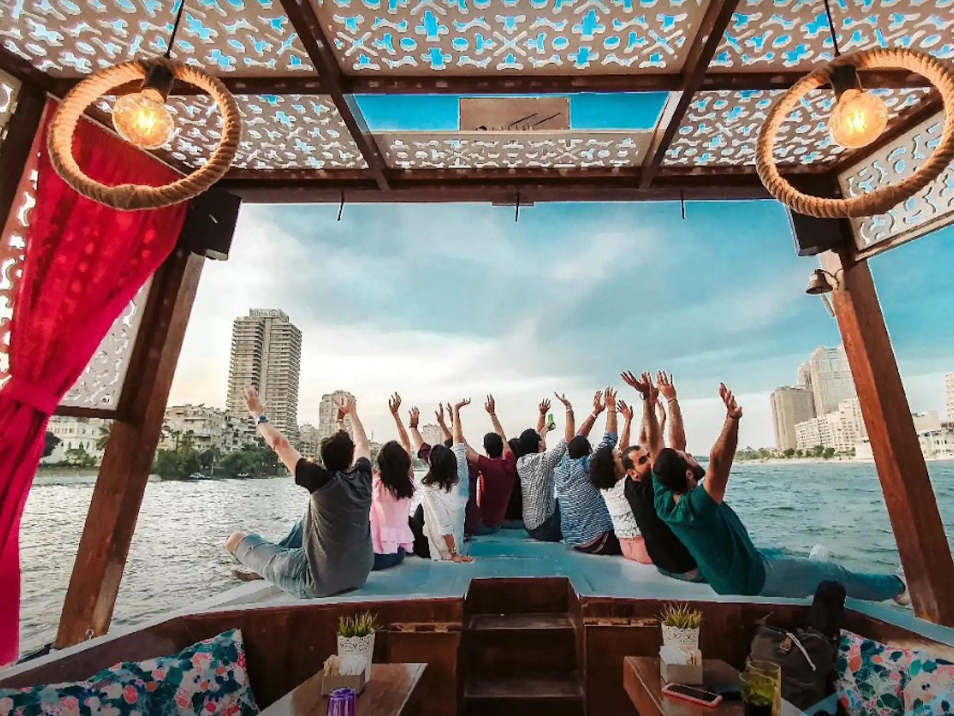 Guests celebrating aboard a Nile felucca