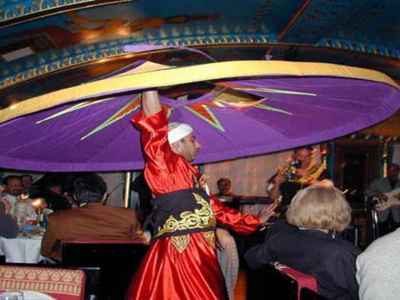 Couple dressed in Pharaonic attire smiling on the boat