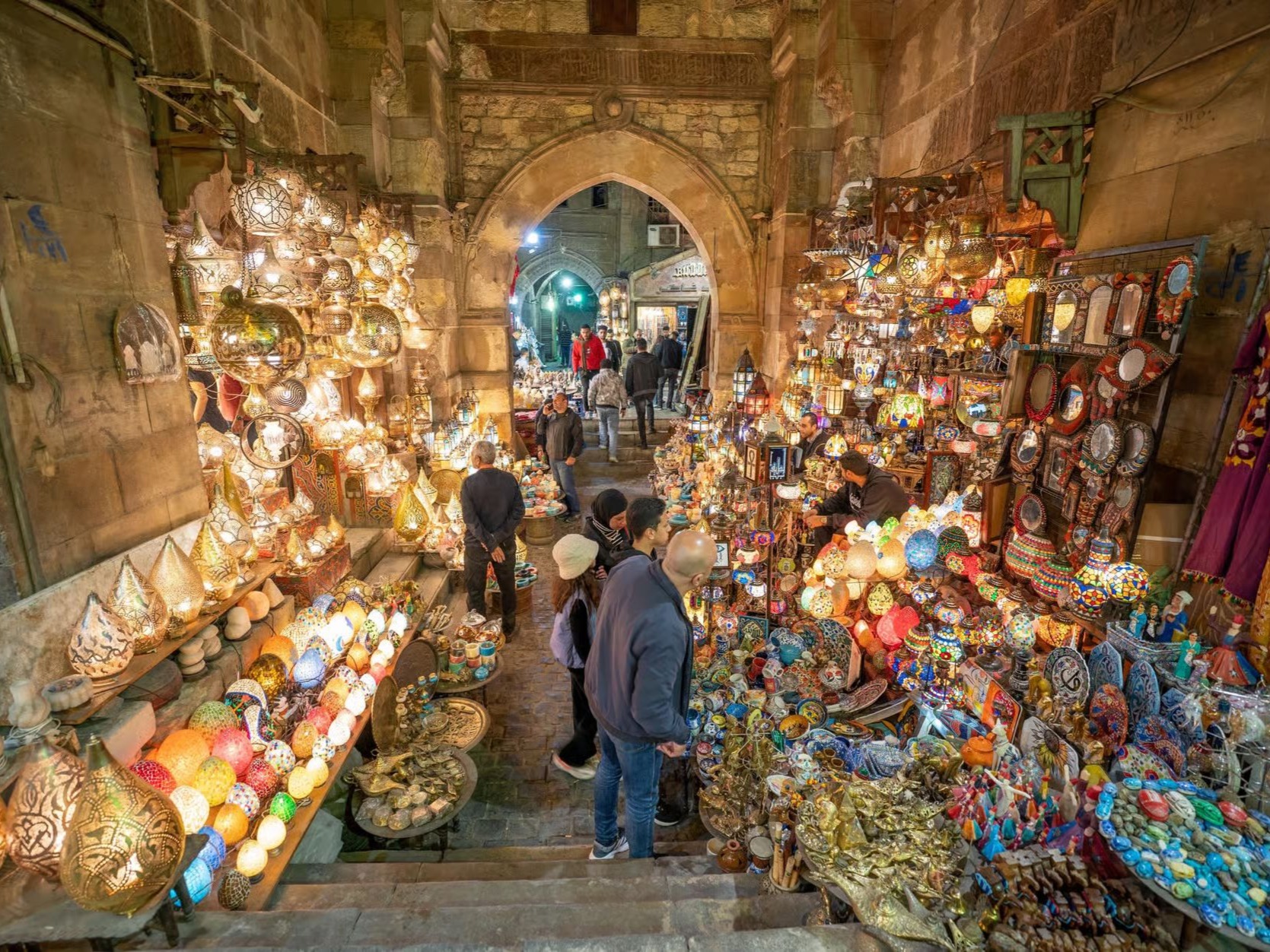 Passengers looking through large underwater windows at the sea floor