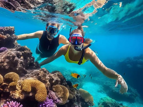 Couple snorkeling in crystal clear water