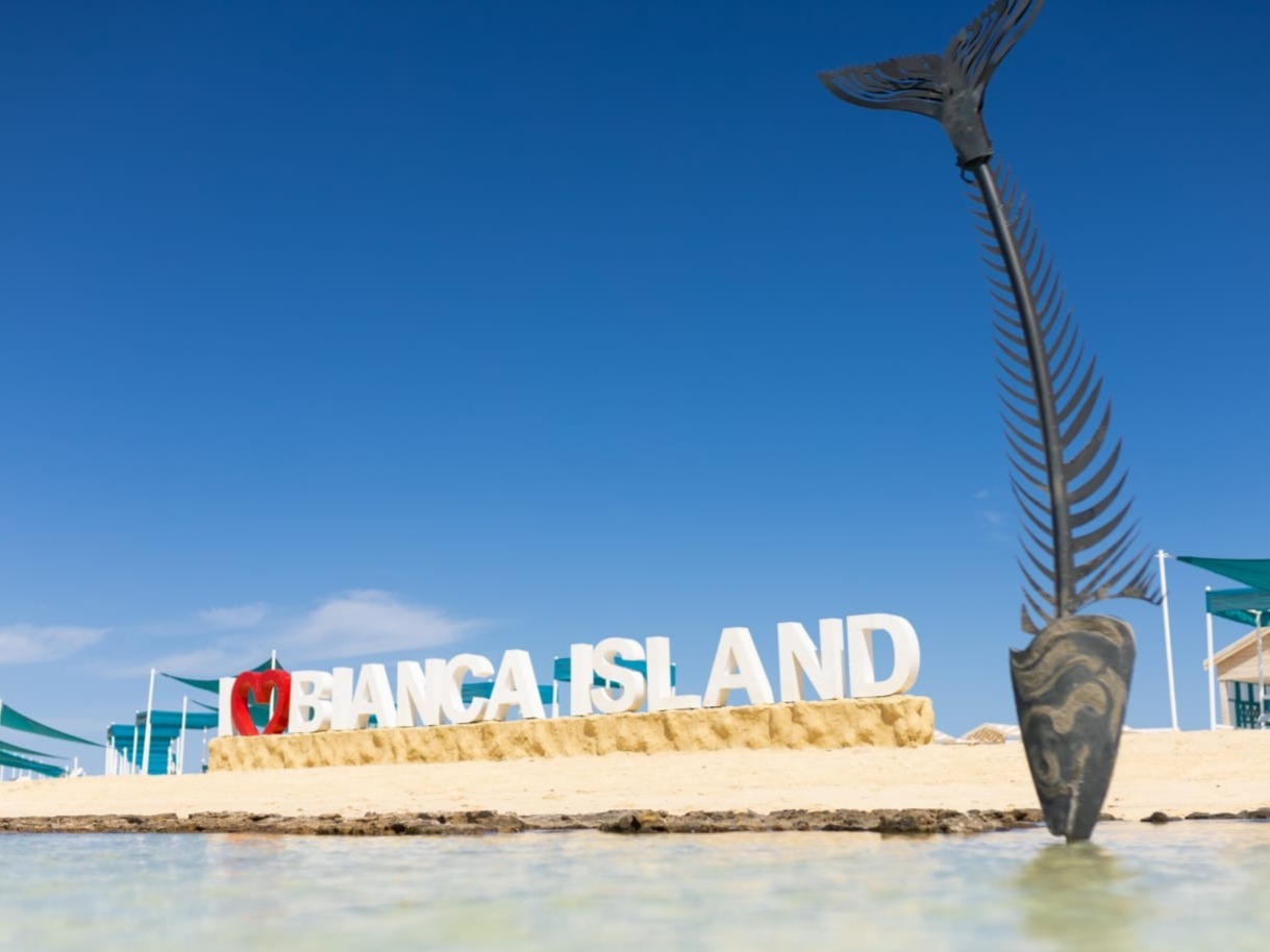 Bianca Island entrance sign and beach