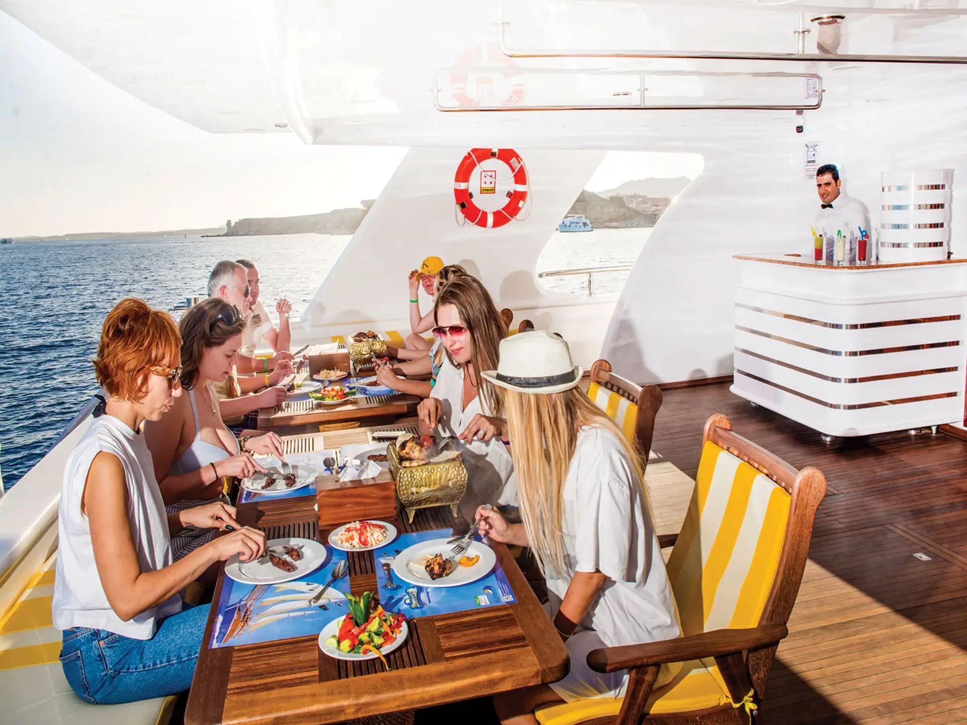 Outdoor dining area on Elite VIP yacht