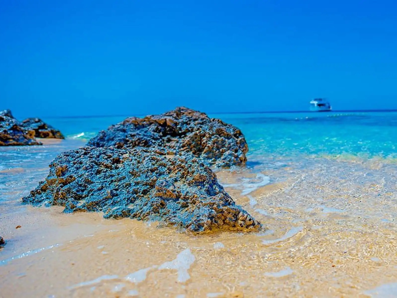 Crystal-clear shoreline at Hula Hula Island