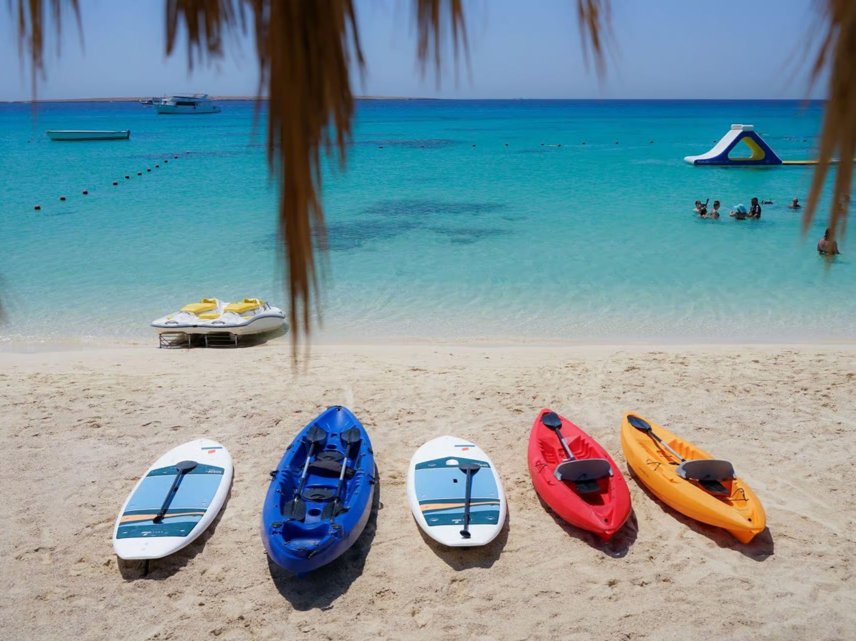 Kayaks and paddle boards on the beach