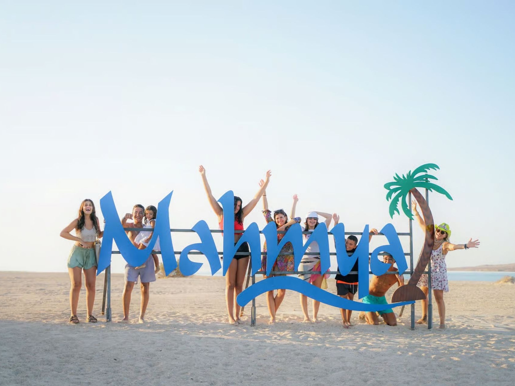 Visitors at Mahmya Island sign