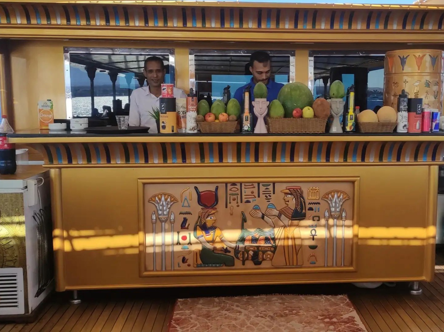 Onboard bar decorated with Egyptian art and fresh fruit