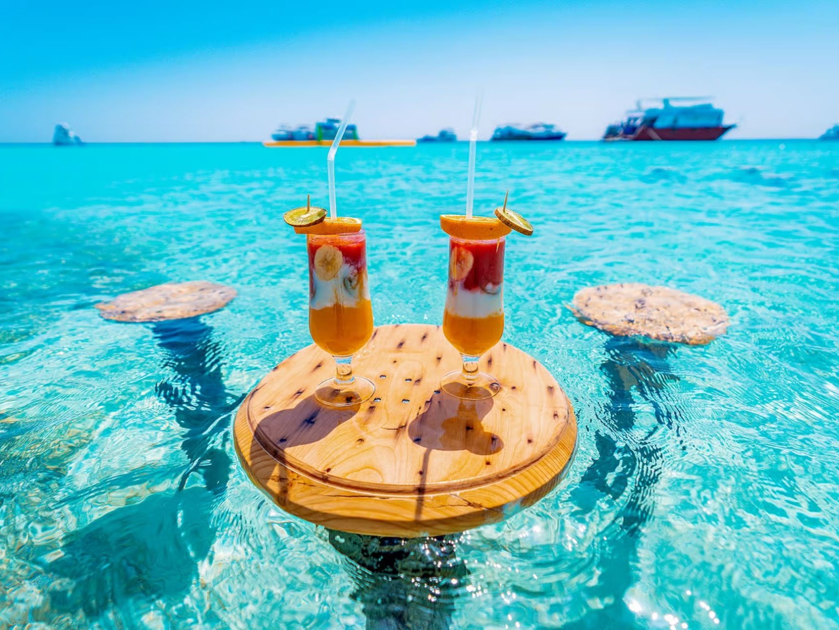 Fresh tropical drinks in crystal-clear water