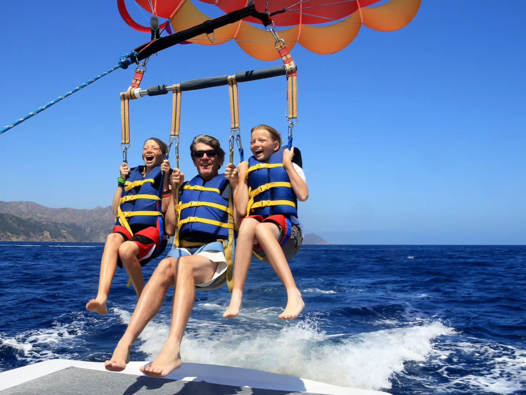 Parasailing over turquoise water