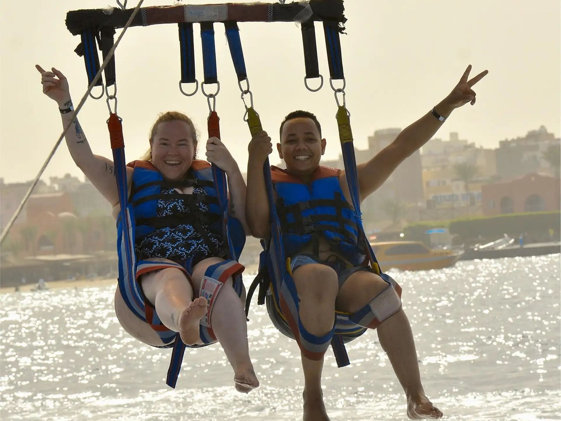 Child parasailing with adult