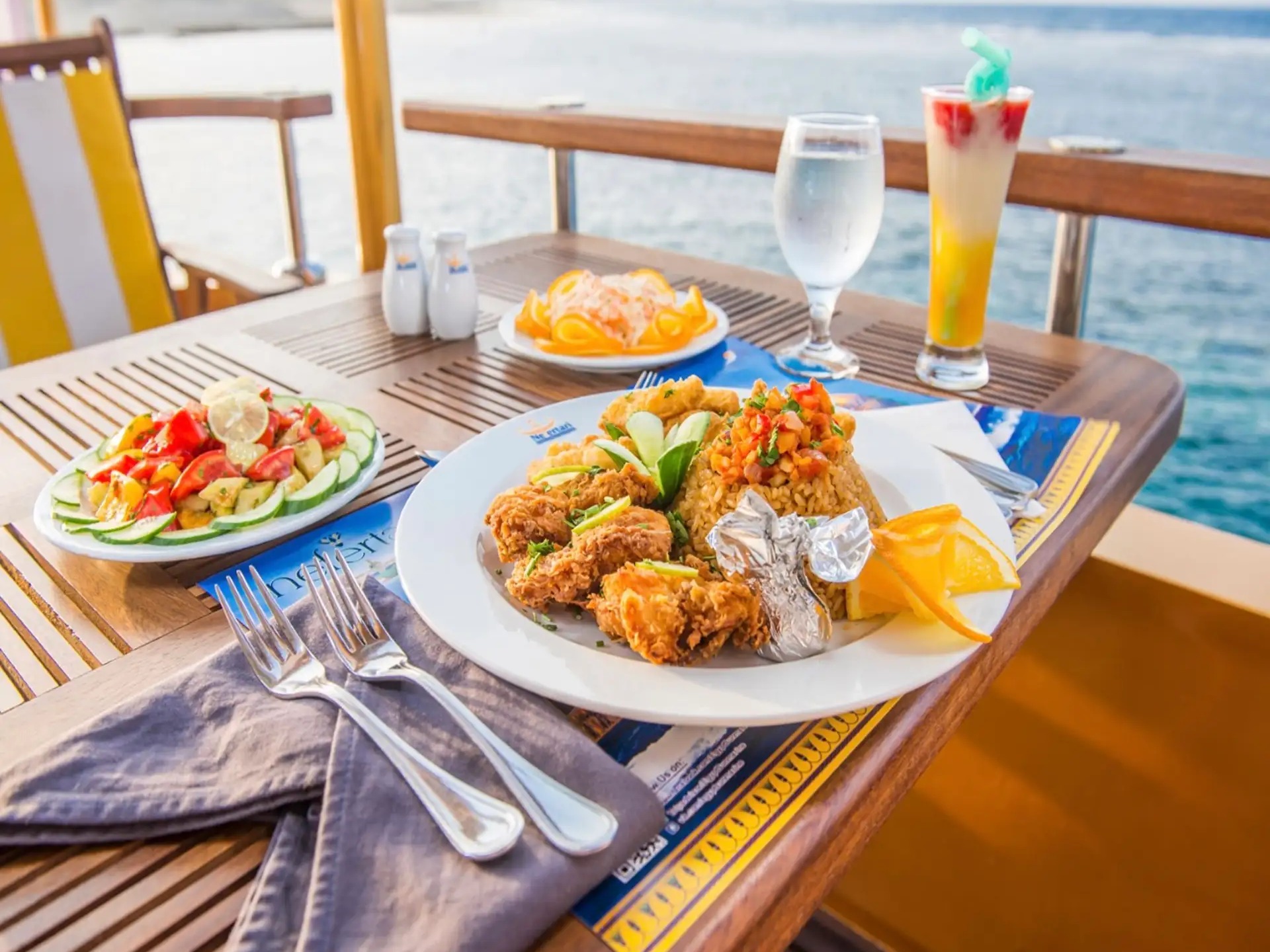 Fresh seafood meal served on a table overlooking the sea