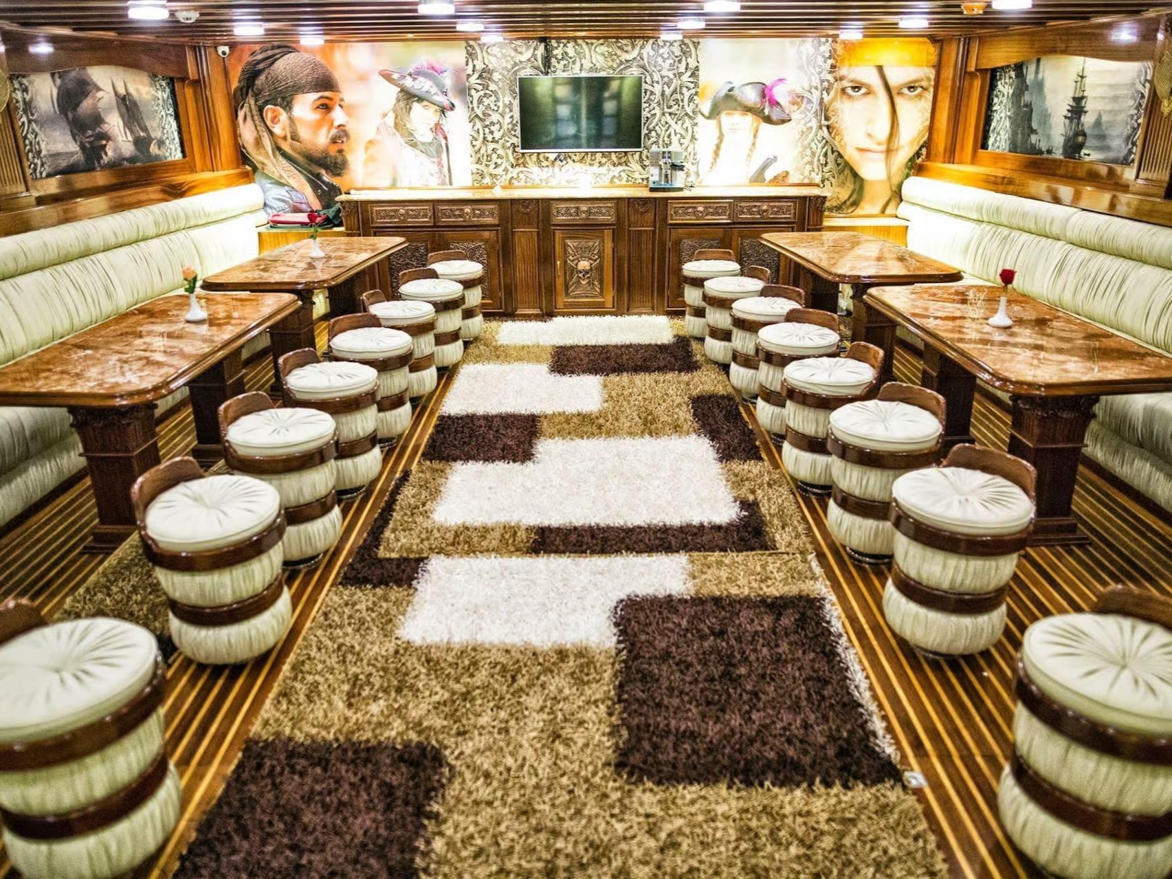 Interior seating area of the pirate boat with tables and chairs