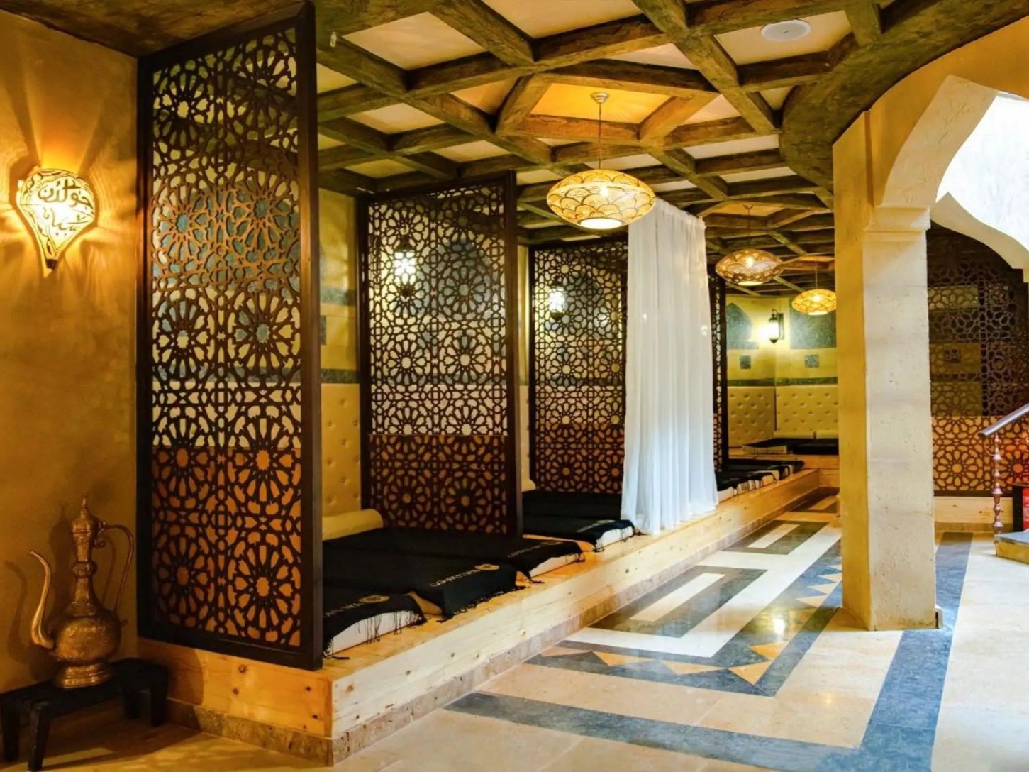Ornate hammam relaxation room with patterned screens