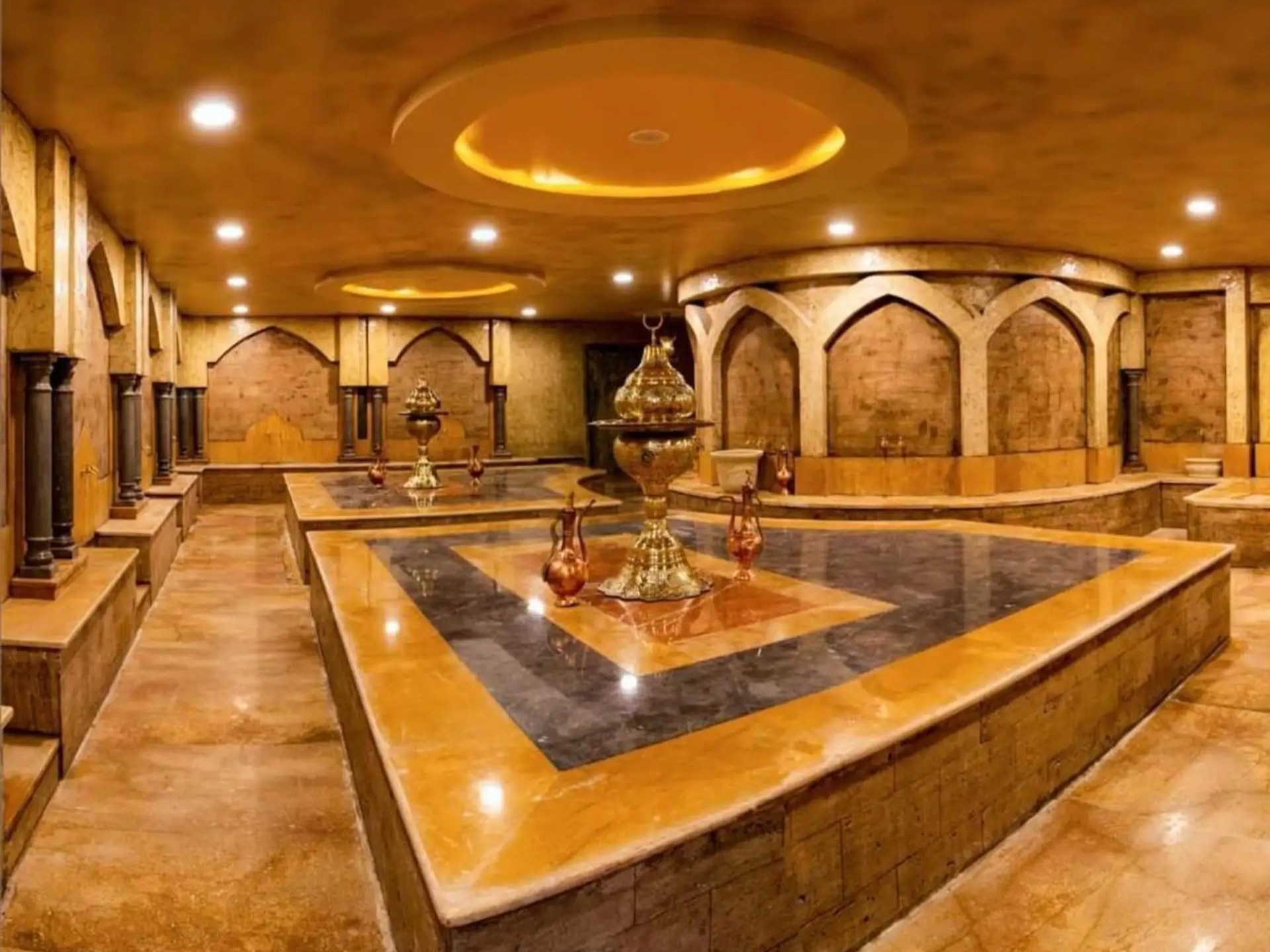 Marble hammam treatment room with a central heated platform