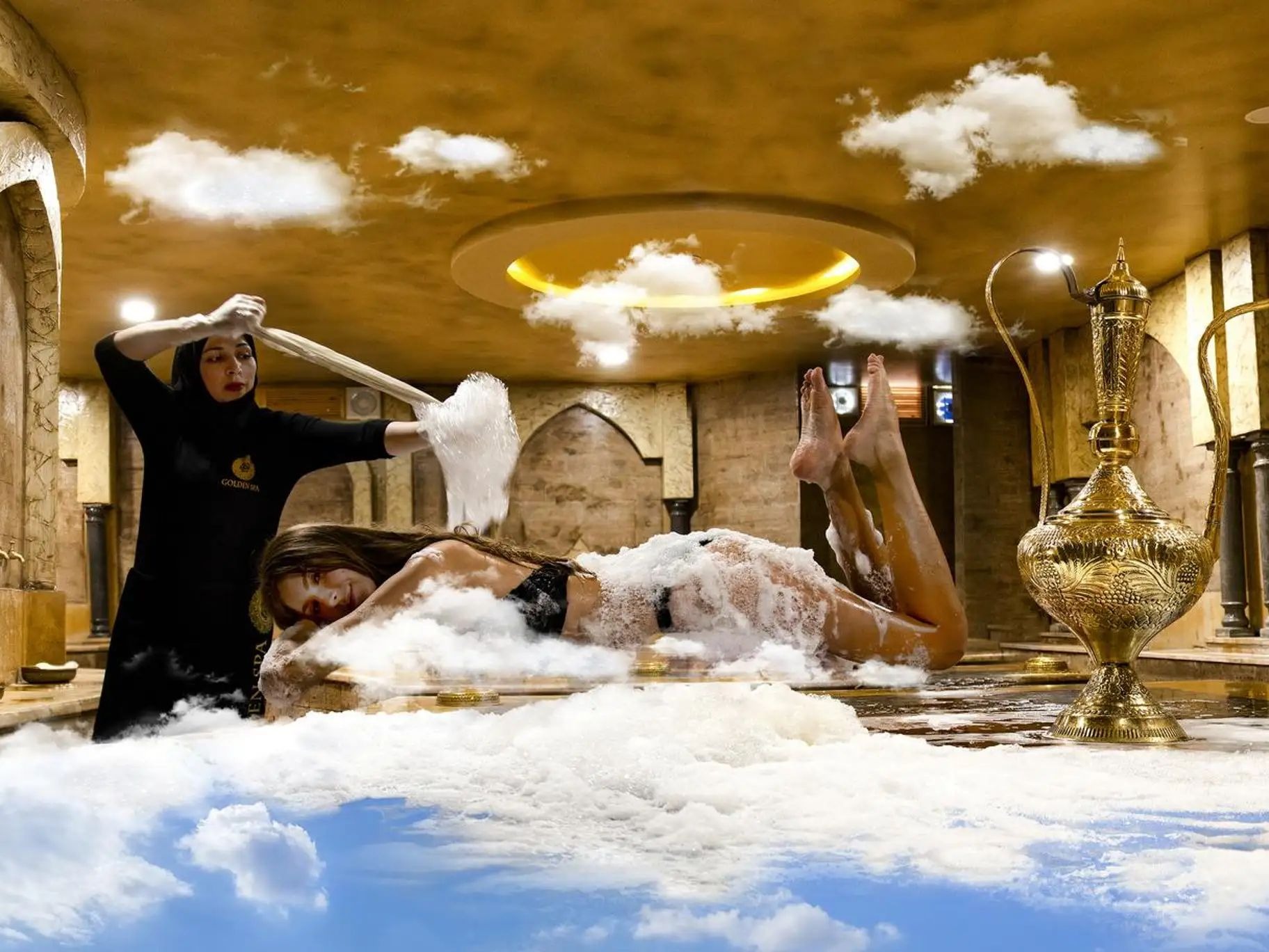 Foam massage treatment on the heated marble platform