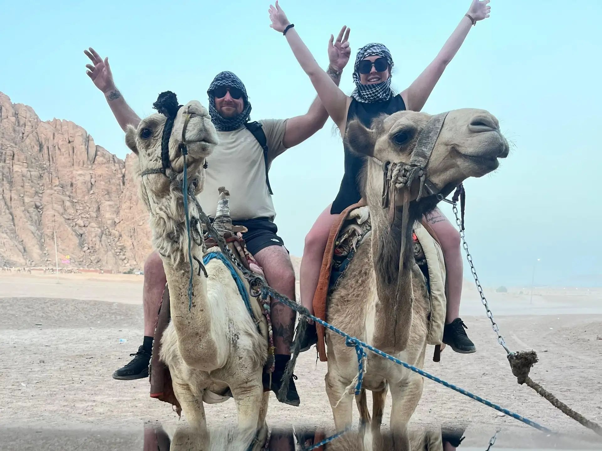 Couple dressed in Pharaonic attire smiling on the boat