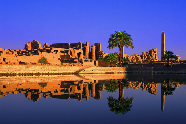 Karnak Temple reflected in the water at sunset