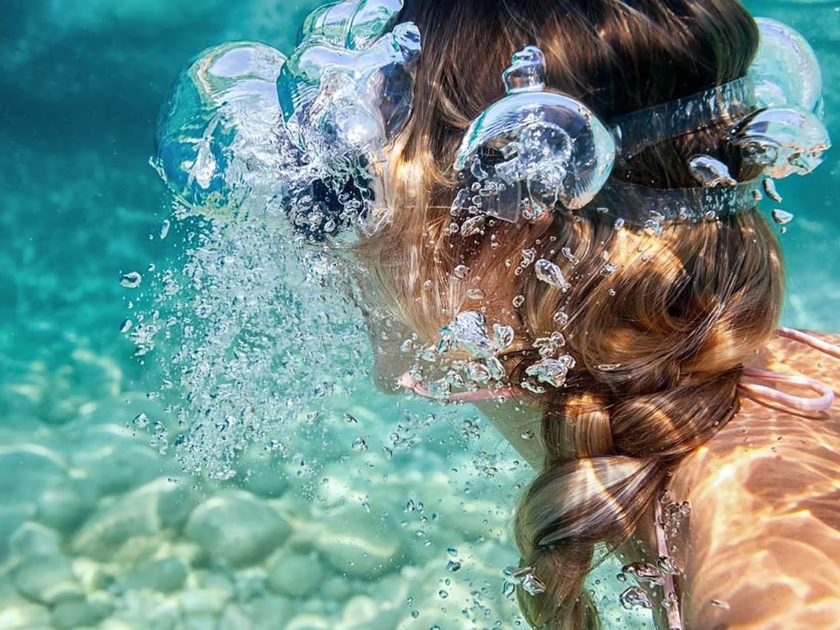 Snorkeller floating above clear water